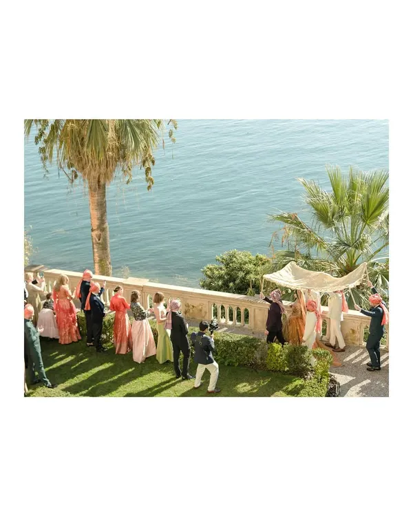 A bride's entrance overlooking the magnificent Lake Garda in Italy. This is what destination wedding dreams are made of, a perfect fusion of culture and breathtaking scenery.