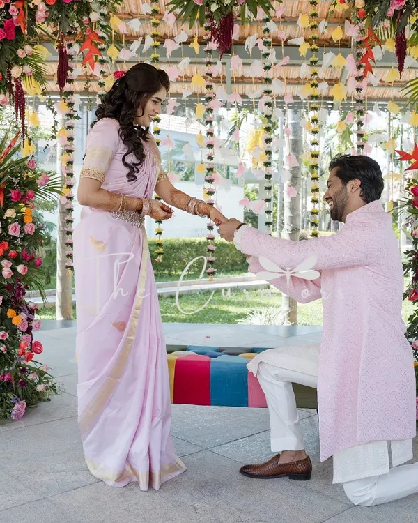 A picture-perfect proposal moment, framed by pillars of lush, colorful flowers. We designed this setting to feel both grand and intimate.