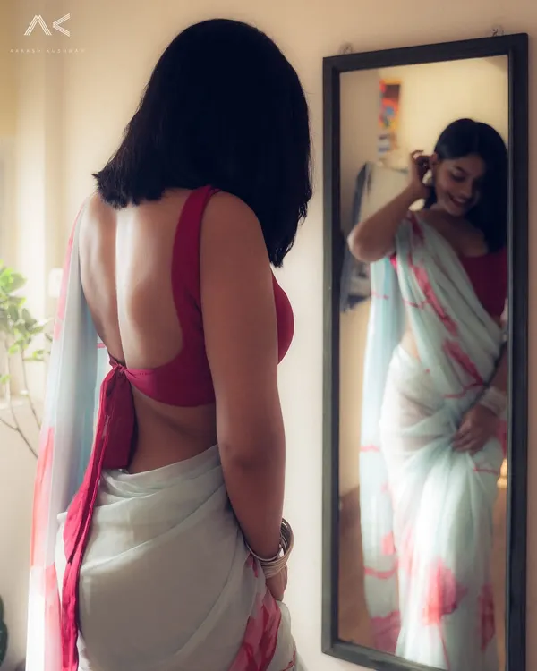This shot captures the quiet, intimate moments I love to create. Using natural light from a window, the focus is on the mood and the story in the reflection, creating a modern and personal take on saree photography.