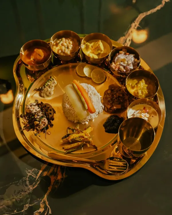 This is my Royal Manipuri Chakluk, a pure vegetarian thali that’s fit for a feast. It features a beautiful spread of traditional dishes, each with its own unique flavor, served on a classic brass plate.