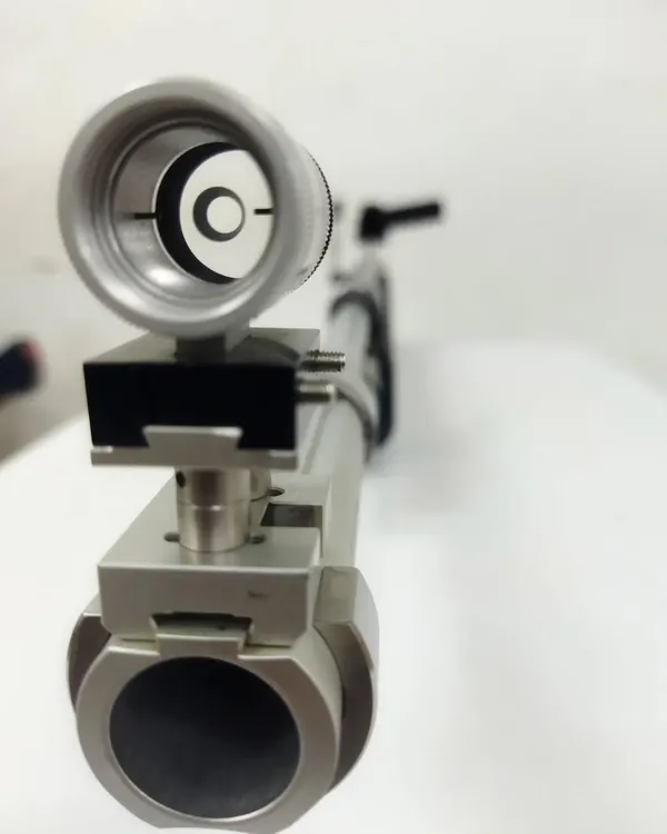 A close up view through the rear diopter sight of a competition air rifle. Perfect sight alignment, as seen here, is the key to placing a shot directly in the bullseye.