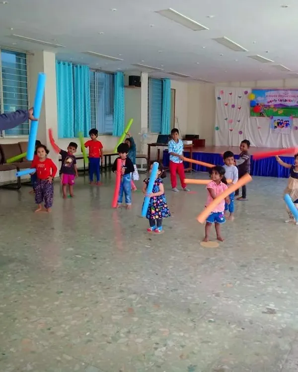 We use props like soft pool noodles for fun aerobic exercises. This activity helps improve coordination and cardiovascular fitness while feeling like a playful sword fight.