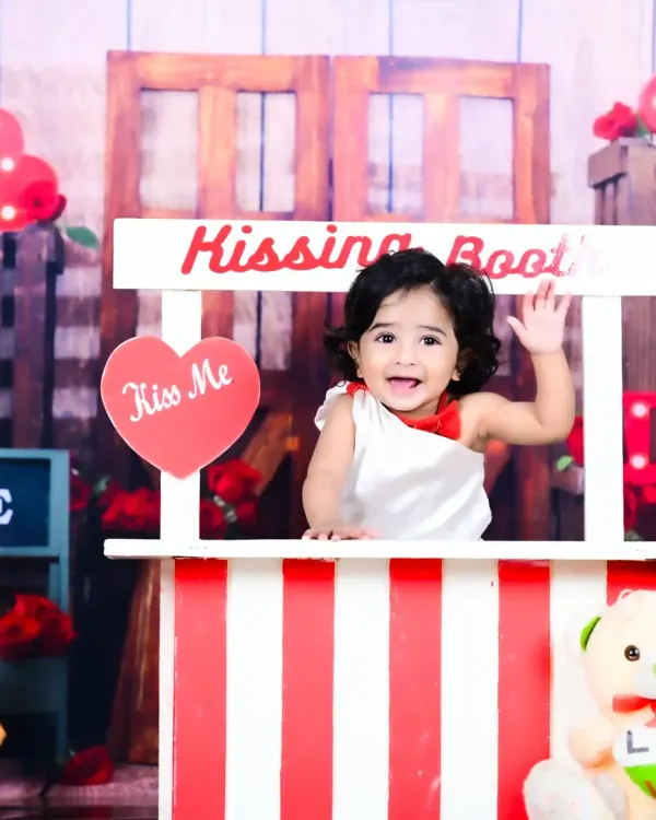 Welcome to the kissing booth, where the smiles are free and the memories are priceless. I love creating these playful, interactive setups for first birthdays. It allows your little one's personality to shine through, resulting in photos filled with genuine laughter and charm.