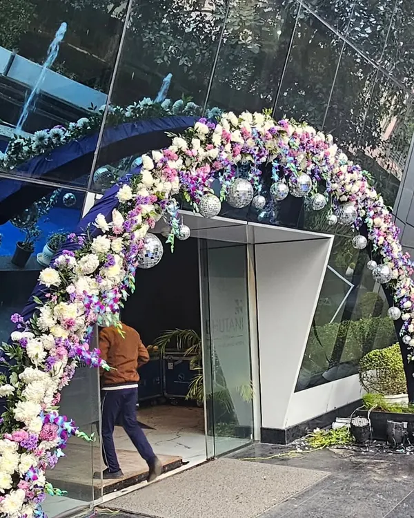 This stunning floral arch, complete with disco balls, created a grand entrance for a major corporate birthday celebration. I design these entryways to make an immediate impression and set the tone for the entire event.