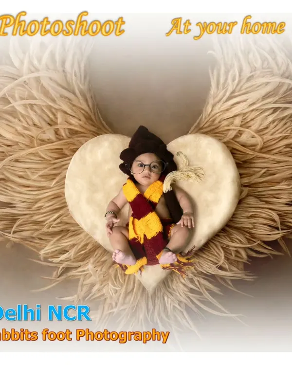 For fans of Harry Potter, I can create a themed newborn shoot. Here, I've edited the baby with glasses and a scarf, placing him in a nest with digital wings for a magical touch.