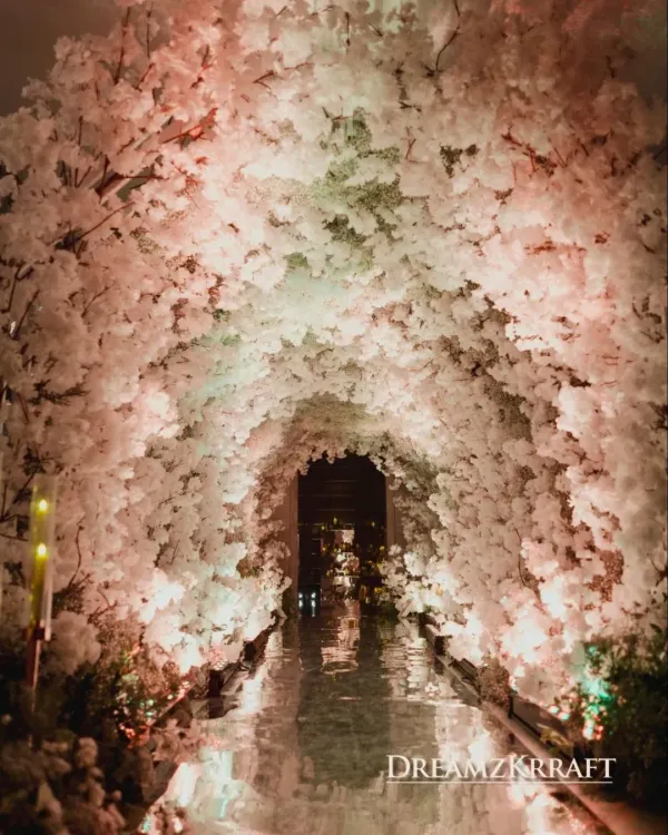 A breathtaking entryway tunnel crafted entirely from white florals. I design these immersive floral installations to create a 'wow' moment for guests, enveloping them in beauty from the moment they arrive.