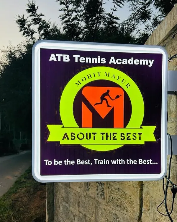The official sign for our academy, ATB Tennis Academy, located in the serene environment of Yelahanka, Bangalore.