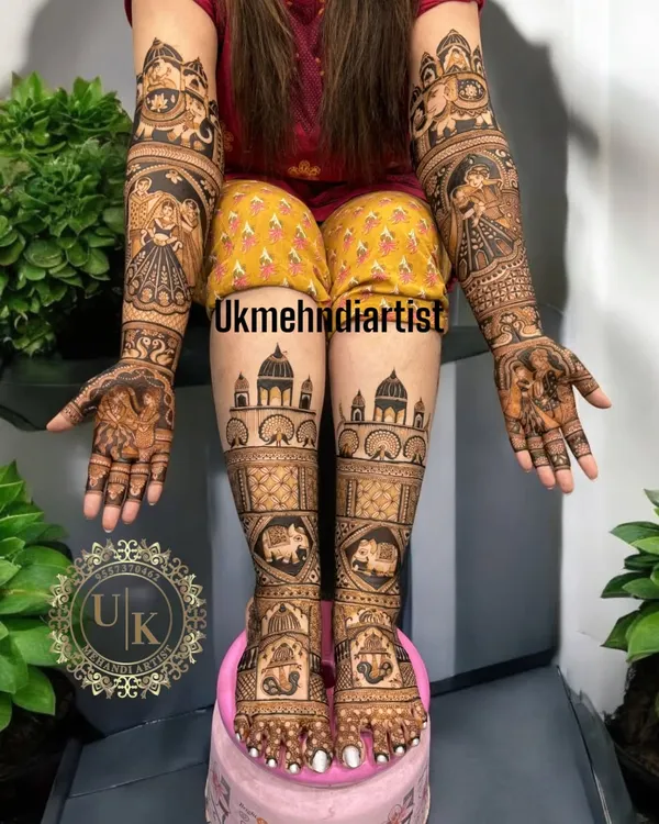 This is the complete bridal look I love to create, with detailed henna art covering both hands and feet. Notice the fine portrait work, the traditional elephants, and the architectural domes, all coming together to make the bride feel special on her big day.