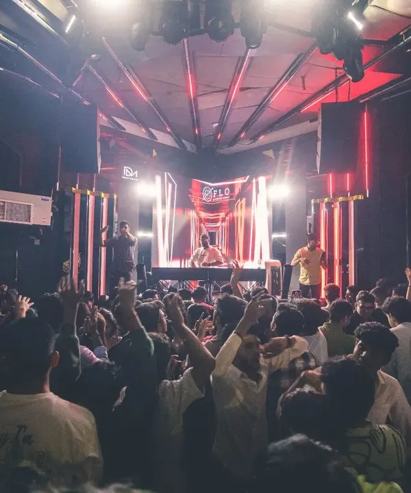The view from my console at Flo on Church Street. A packed floor with everyone's hands up is the best feedback a DJ can get. This is the energy I bring to every Bollywood DJ night.
