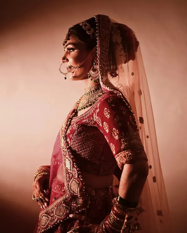 This is the kind of timeless bridal portrait I love to create. I use dramatic lighting to sculpt the features and highlight the intricate details of the bridal wear, capturing a quiet, powerful moment that feels like a scene from a fairytale.