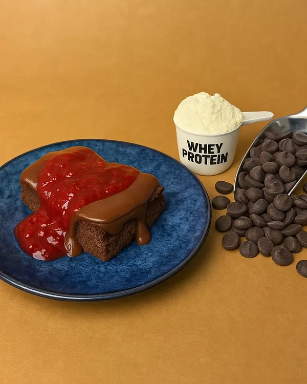 This is how I pack 18g of protein into a dessert. My Chocolate Berry cake bar is made with real whey protein and topped with a rich chocolate ganache and berry compote. It's the perfect zero-sugar, grain-free treat to help you meet your fitness goals.