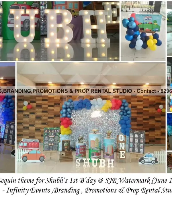 A "Cars & Trucks" themed first birthday with a sparkling sequin backdrop. This comprehensive setup includes marquee letters, a "ONE" table, and a colorful balloon arch, creating a fun and festive party zone.