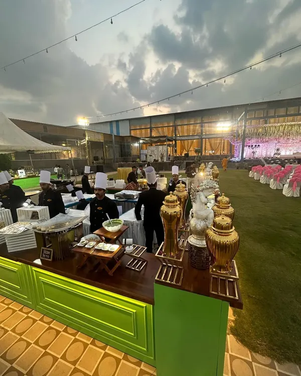 We design our luxury vegetarian buffet setups to be a feast for the eyes. This wide view captures our team in action at a large outdoor wedding, showcasing the scale and professionalism we bring to every event.