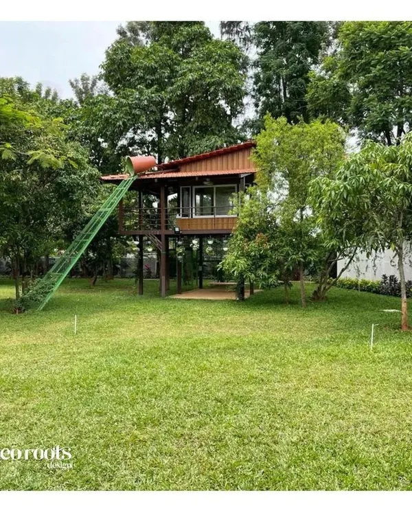 As part of a large farmhouse landscape, we designed and built this charming treehouse. It is a whimsical and functional structure that provides a unique retreat and play area, seamlessly integrated among the mature trees.