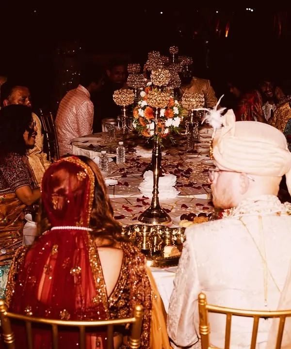 A wedding couple seated for their meal, surrounded by family and friends. It's a privilege to be a part of such important moments, ensuring the food is perfect for the occasion.