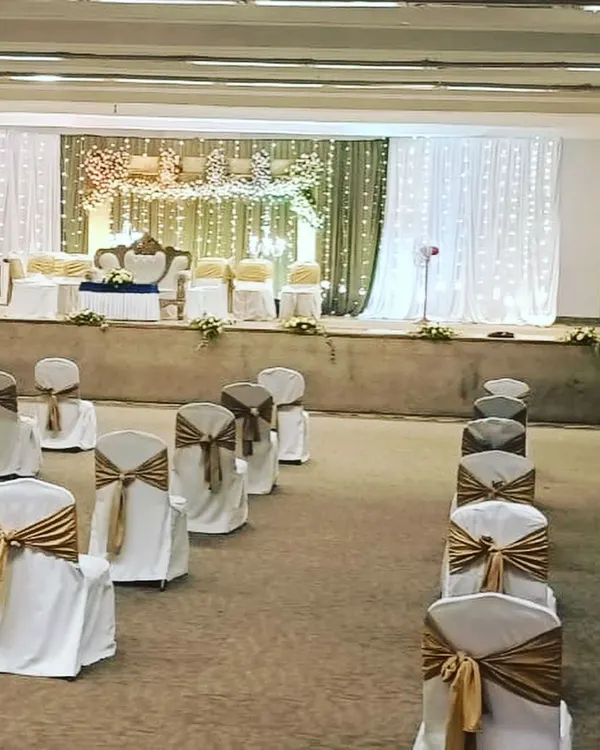 A view of our socially distanced seating arrangement for a wedding during the pandemic. We ensured guest safety by spacing chairs appropriately while maintaining an elegant and organized look with beautiful chair covers and sashes.