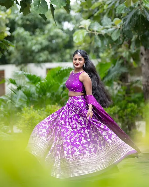 This is the energy I live for. A happy client, a twirl-worthy lehenga, and a color that just screams confidence. I made this vibrant purple Banarasi lehenga with a modern halter-neck blouse for a client who wanted to make a statement.