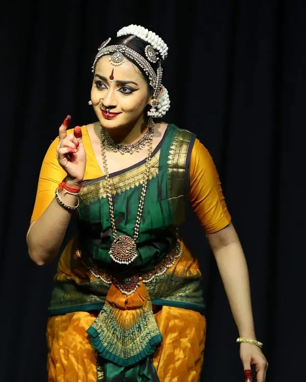 Portraying the Nayika, or heroine, during the Ninada Nruthyotsava. The expression here is one of gentle persuasion, as she speaks to her sakhi (friend).