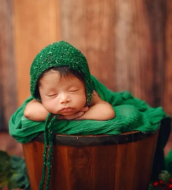 This is the peaceful, timeless portrait I love to create. Capturing a newborn's serene sleep in a cozy, rustic setting helps you remember just how tiny and perfect they were in their first few weeks.