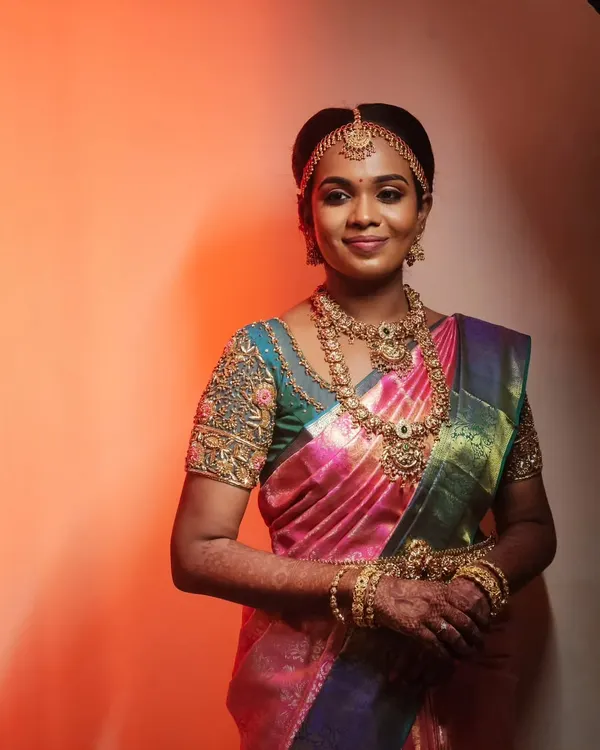 This is the classic South Indian muhurtham look that so many of my brides love. The focus is on creating flawless, radiant skin that looks beautiful in person and in photos, paired with defined eyes and traditional gold jewelry to complete the look.