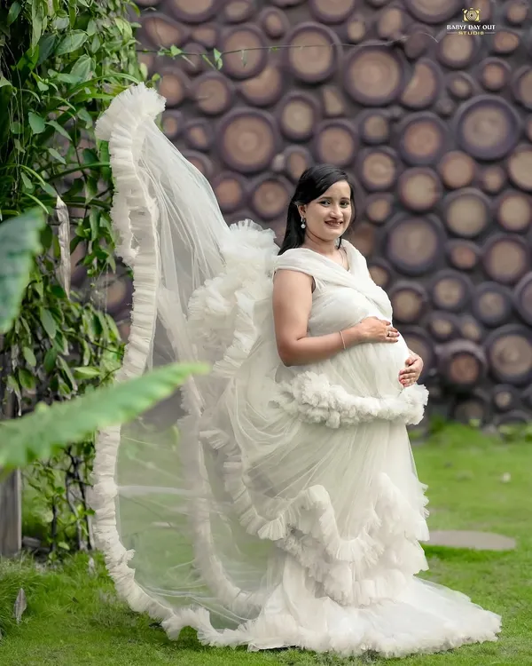 This is the moment to celebrate your beautiful journey. We love creating these dreamy, fairytale-like portraits for mothers-to-be in our private garden, using flowing gowns to add a touch of magic.