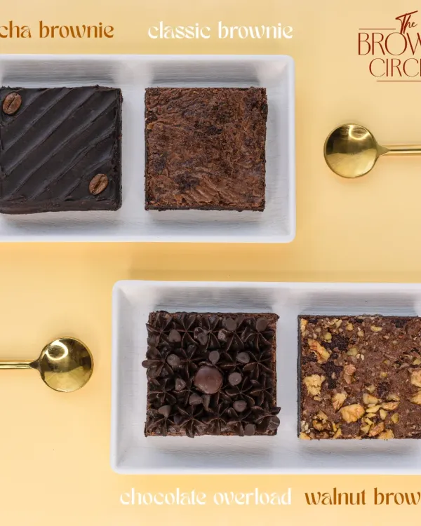 A lineup of our bestsellers, showcasing the variety we offer. From the rich Mocha and Classic brownies to the decadent Chocolate Overload and crunchy Walnut, each one is crafted to be perfectly fudgy.