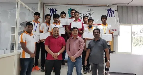 A group of our 2020 competition participants and winners posing with their certificates alongside the coaching staff. We foster a strong sense of community and team spirit.