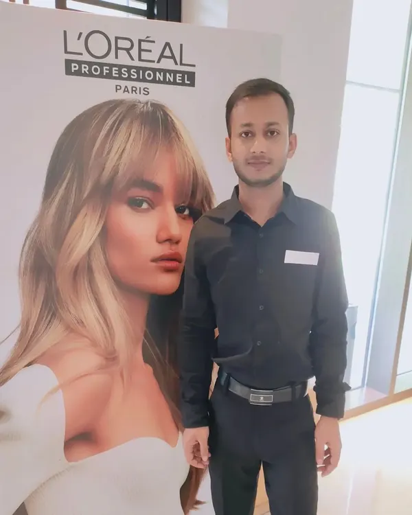 Attending a L'Oreal Professionnel seminar to learn about new products and styling methods. Continuous education is key in the hair industry.
