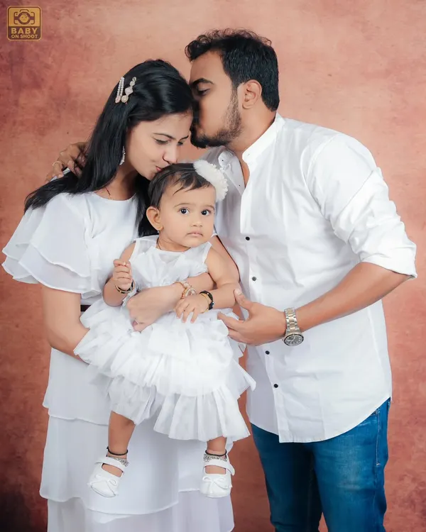 This is what it's all about for me: capturing the pure love and connection of a family. I suggested coordinating in white for this studio session, and the result is this timeless, classic family portrait that they can cherish forever.