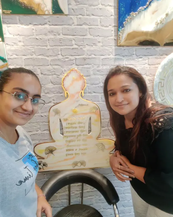 So much gratitude! I am pictured here with my student and the beautiful Resin Navkar Mantra wall decor she made for her new home during our one-on-one session.
