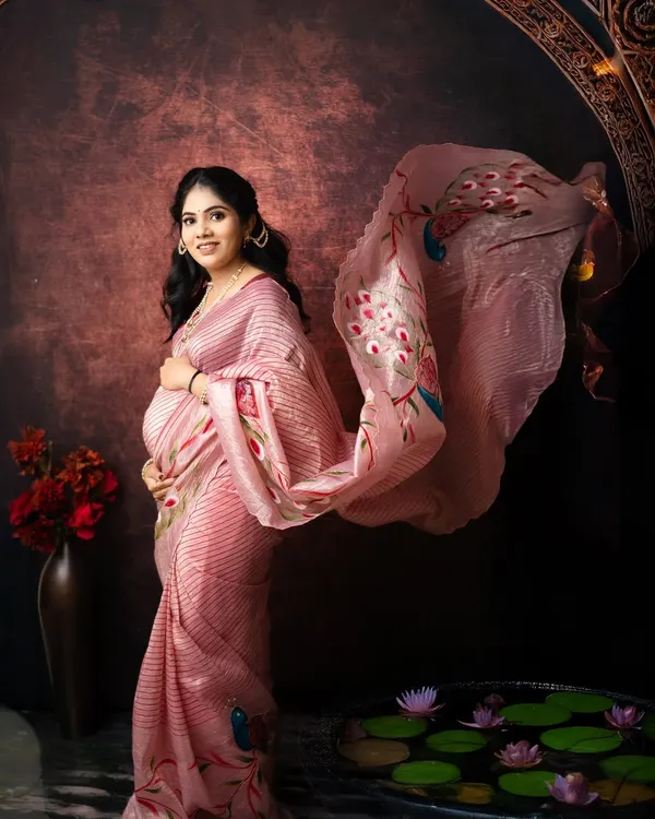 I love creating these timeless portraits where every detail feels like a brushstroke on a canvas. Here, the flowing pallu of the saree adds a touch of magic to this serene moment of anticipation.