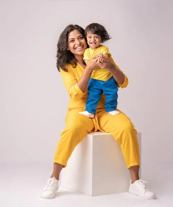 When you can't find the sunshine, be the sunshine. This little guy, at his 9-month milestone session, is pure, happy energy in his bright yellow outfit.