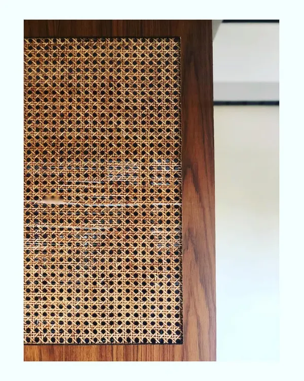 I absolutely love using cane in my furniture designs. This close-up shows the beautiful, natural texture of woven cane within a dark wood frame, a detail that adds so much warmth and character.