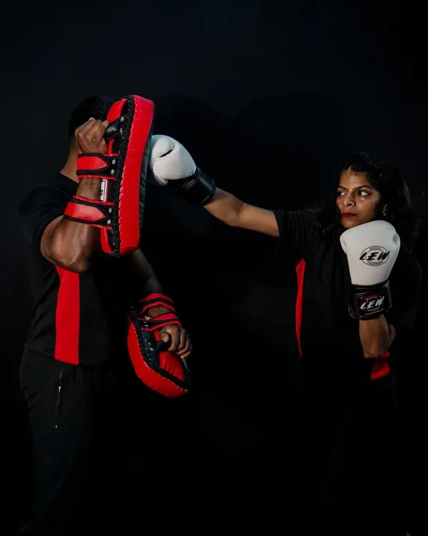 This is where strength and technique meet. We focus on high-impact striking drills, like this pad work session, to build power, precision, and speed. It's not just about fitness; it's about developing the muscle memory you need to react effectively.