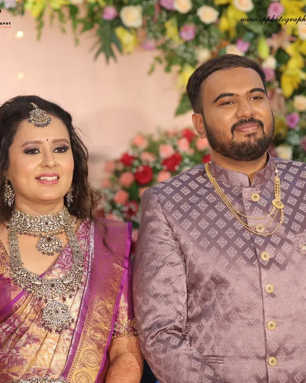 A classic portrait of the couple at their reception. Dressed in their finest, this shot captures the elegance and happiness of the evening celebration.