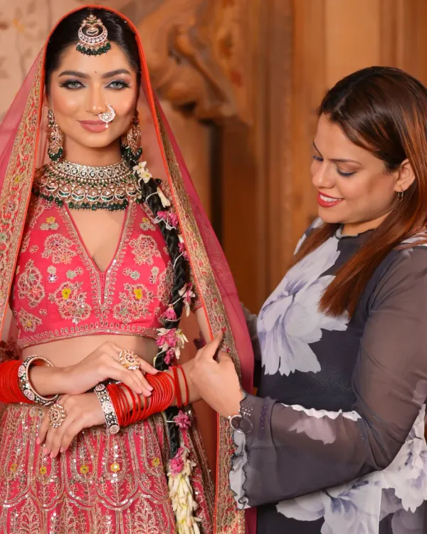 Here I am, carefully setting the dupatta for this bride's fairytale look. It's these final details that bring the entire vision together.