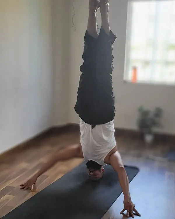 I am so inspired by my student's dedication. Here he is challenging himself with inversions, showing how consistency is the key to progress in your yoga journey.