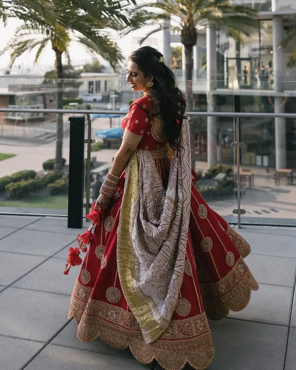 A beautiful shot of the bride in her stunning red Nidhi Tholia lehenga at her sangeet in San Diego. The perfect twirl shot is a must have for every dancing bride.