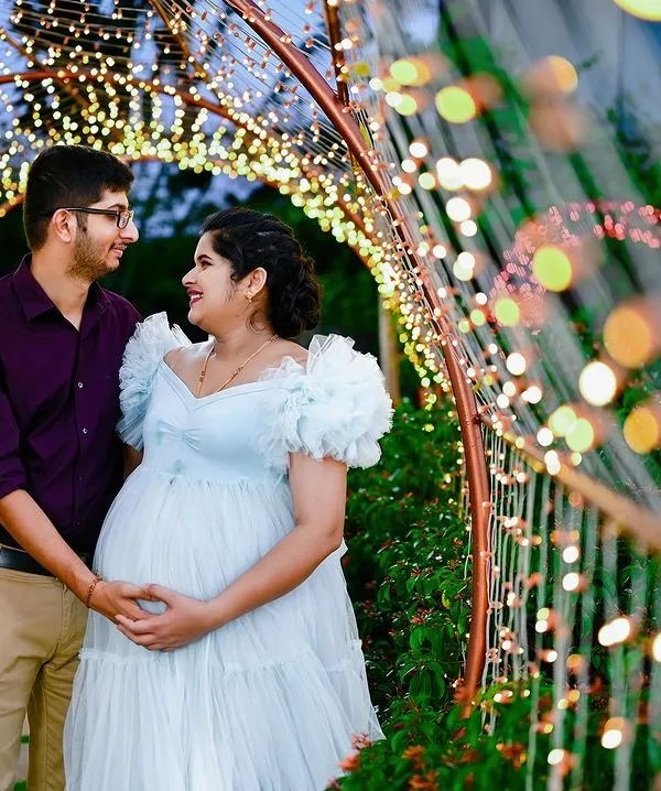 This is one of my favorite kinds of shots to create. The fairy lights add such a magical, dreamy feel to this beautiful moment for the expecting couple.