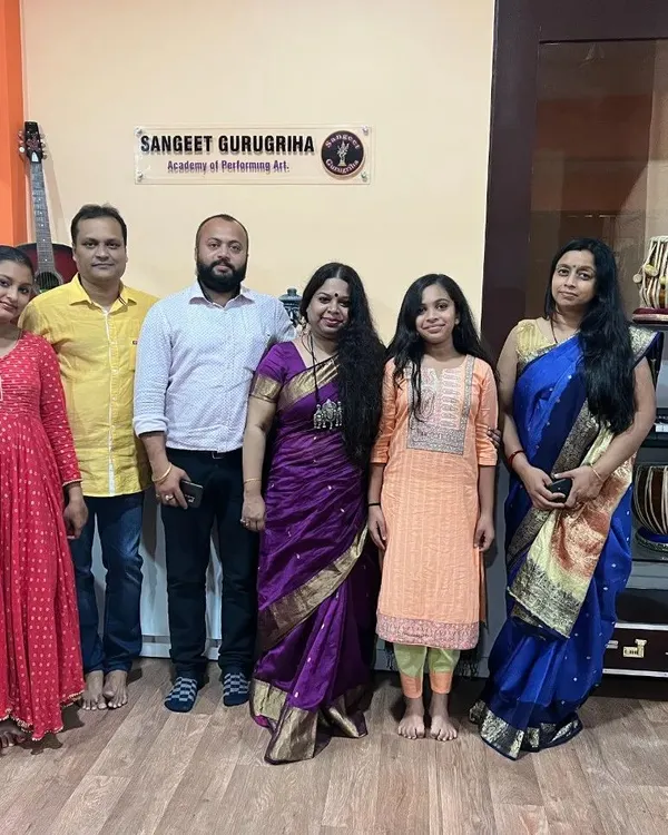 A cherished group photo with students and gurus after a successful examination day.