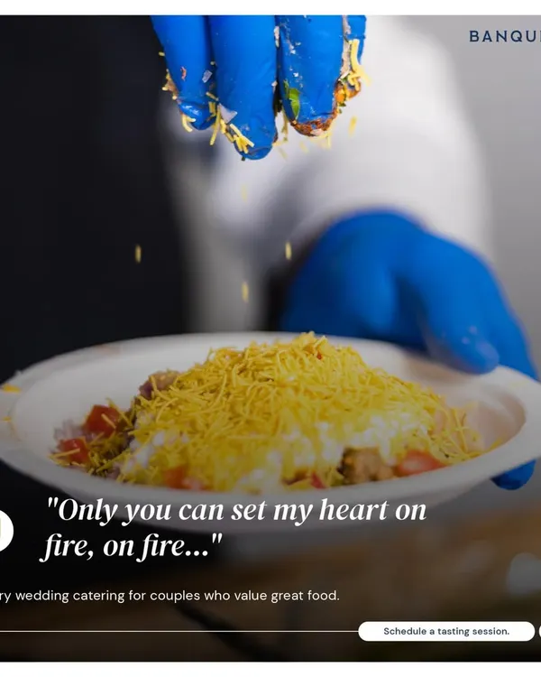 A chef's hands sprinkling sev over a plate of papdi chaat. Our dishes are an orchestra of spices, flavors, and textures that create a memorable, interactive experience for your guests.