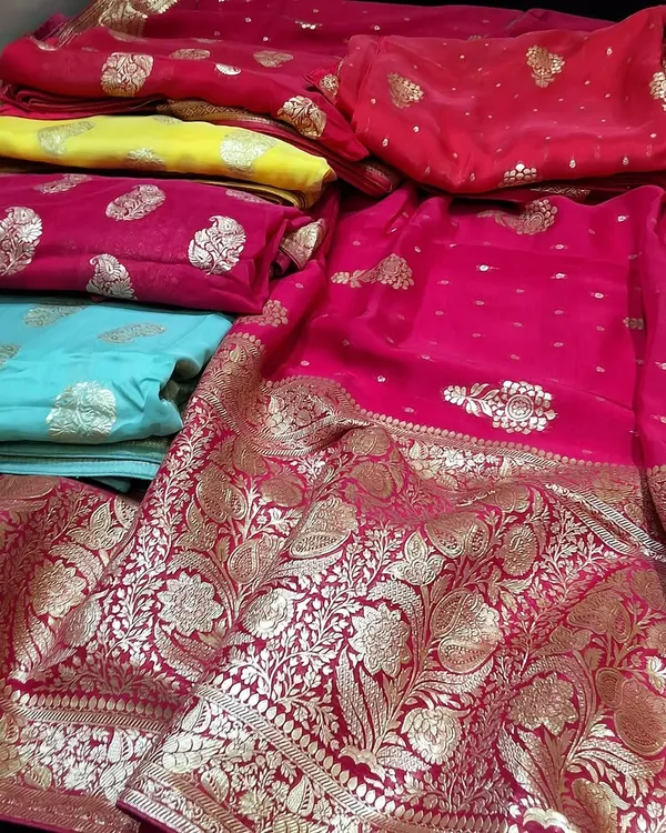 This is the kind of beauty that makes my heart sing. A gorgeous, rich red Banarasi saree with intricate gold zari work, perfect for weddings and grand celebrations. I always keep a variety of these timeless pieces, each one a masterpiece.