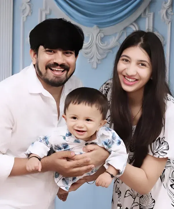 This is what pure joy looks like. I focus on creating classic family portraits where your smiles and connections are the main event, set against an elegant studio backdrop.