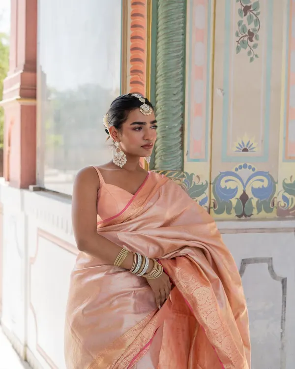 We are in our silk saree Banaras mood. This beautiful baby pink silk saree is a timeless piece, perfect for any traditional occasion.