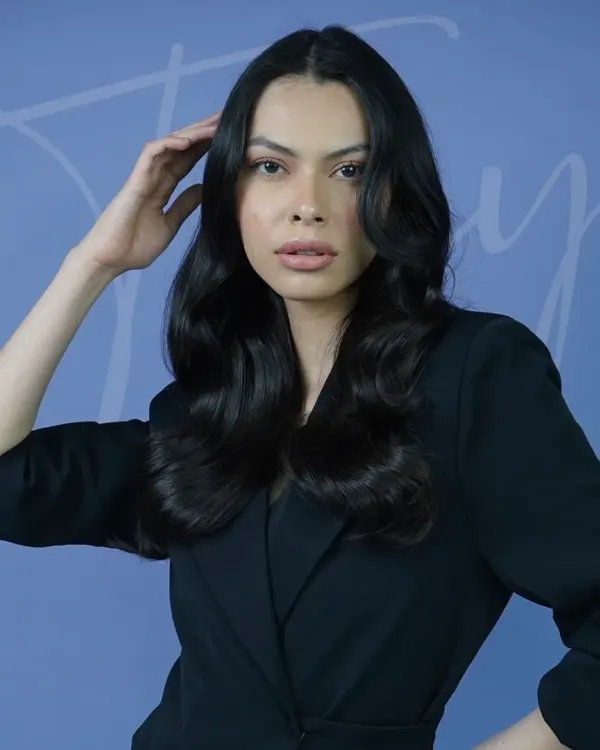 This is the result of refined craftsmanship. A soft, wavy blowout on long hair, created by our Head of Education. The style embodies sophistication in motion, with each wave perfectly placed to create volume and shine using our Label.M professional range.