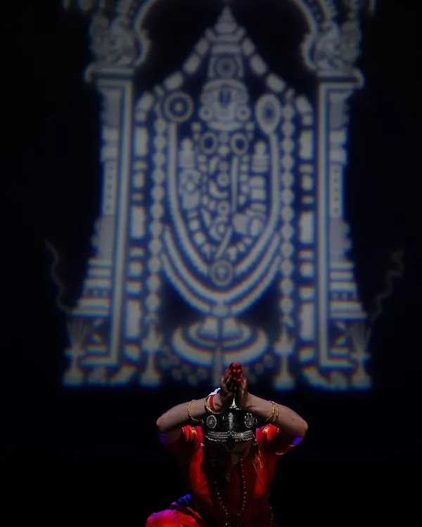 A moment of complete surrender from my solo thematic production, "Venkatesha Shreesha." Here, I portray a devotee's final arrival at the holy abode of Tirumala, a culmination of a long spiritual journey. The lighting and projection are designed to evoke a sense of divinity and awe.