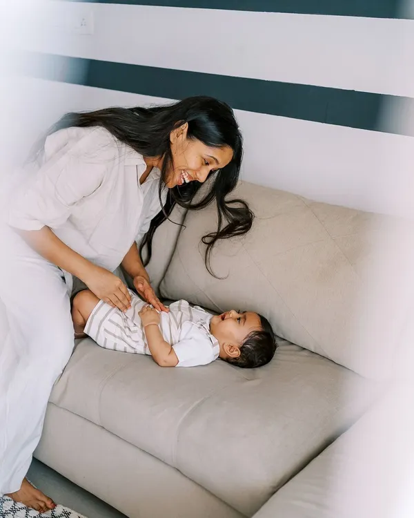 The beautiful light in this house made the indoor part of our shoot truly magical. A mother playing with her baby on the sofa is a simple, perfect moment of connection.