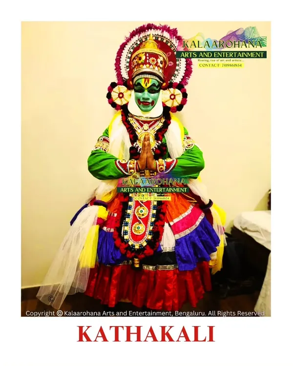 A Kathakali artist in full traditional regalia. This 'Pacha' (green) makeup represents a noble, divine hero, and the entire costume is handcrafted to reflect the centuries-old traditions of this revered art form.
