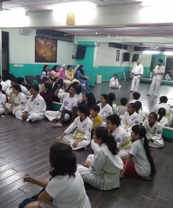The dojo is a family. Here, students and parents gather to say farewell to Senpai Harjas. These moments of togetherness are just as important as our training on the mat.