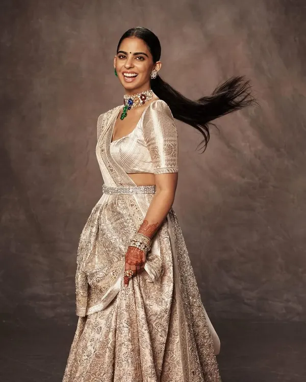 This is one of my favorite moments, styling Isha Ambani Piramal in a breathtaking custom Manish Malhotra lehenga. The movement in her hair and the joy on her face capture the exact energy we aimed for. It’s a perfect example of modern Indian couture styling.